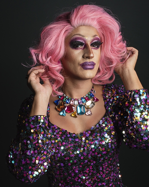 Four drag queens dressed in drag